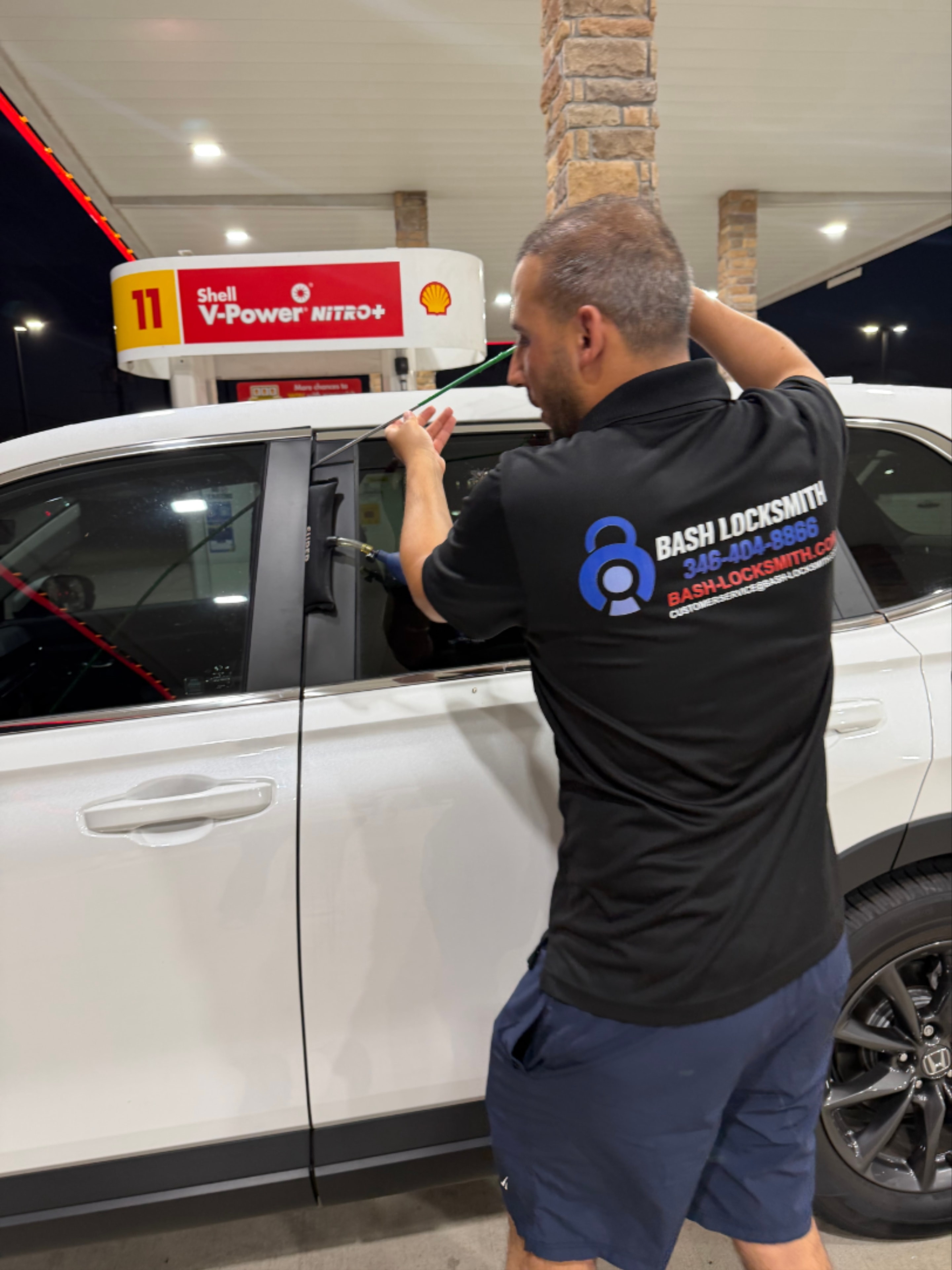 Locksmith opening white car door