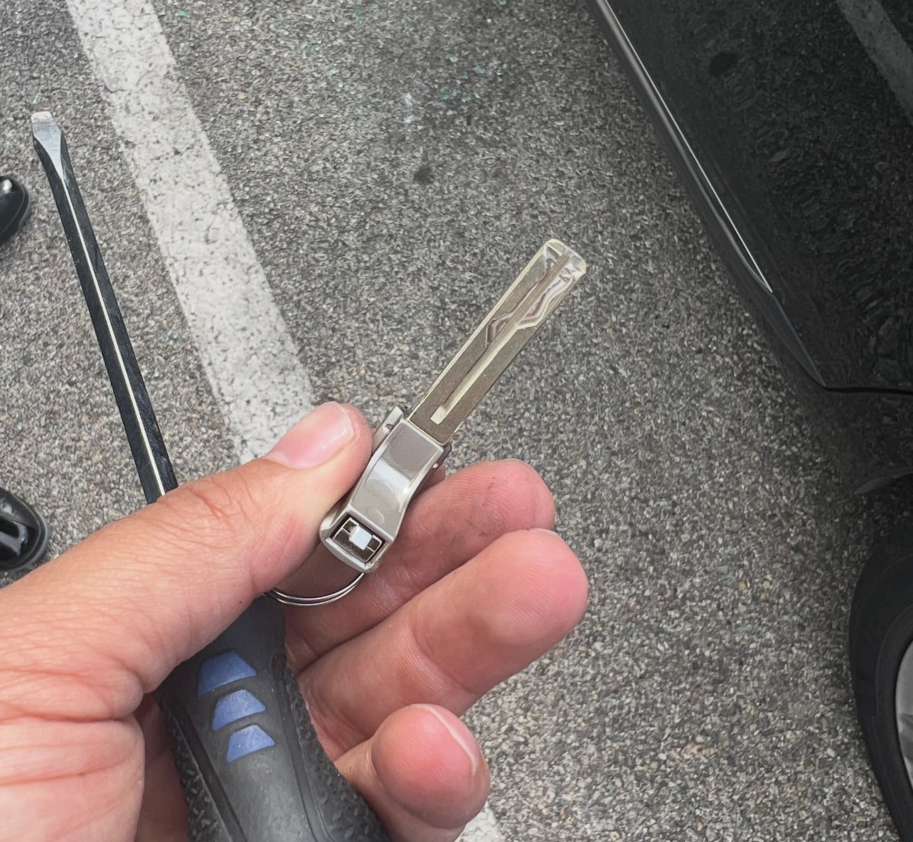 Hand holding car key fob