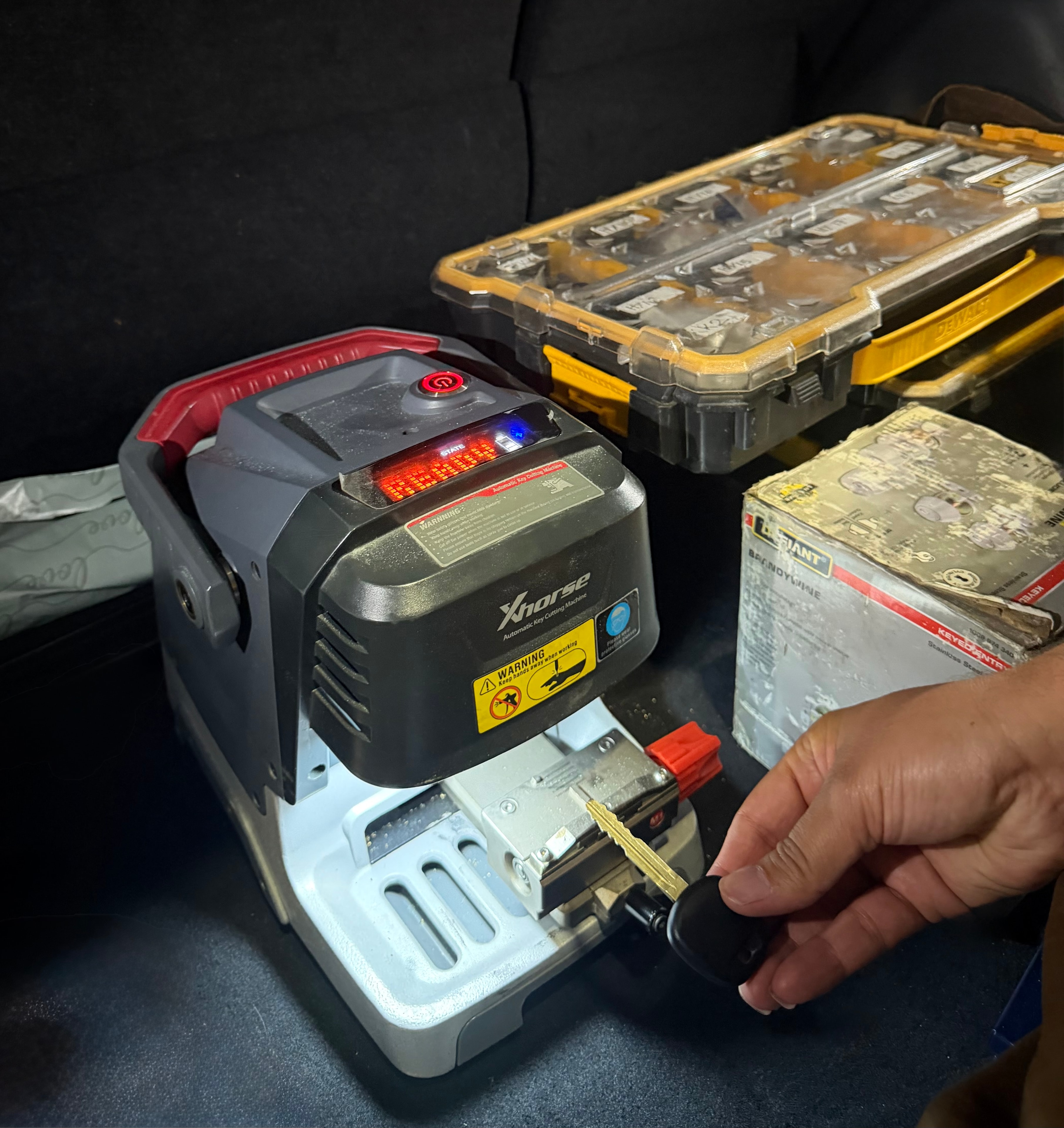 Person using Xhorse key cutting machine